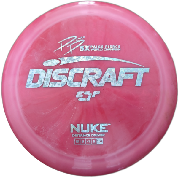 ESP Nuke from Discraft. Paige Pierce 5x World Champ Signature Series. Colour is Pink with a Silver Heart stamp.