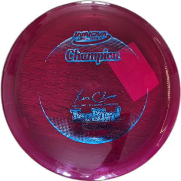 Champion Teebird from Innova. Colour is Maroon with a silver and blue stamp.