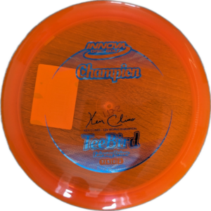 Champion Teebird from Innova. Colour is Orange with a silver and blue stamp.