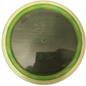 Proton Insanity from Axiom Discs. Colour is transparent Green with yellow rim and faded stamp. Back shows faded ink.