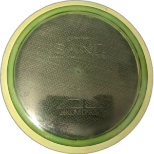 Proton Insanity from Axiom Discs. Colour is transparent Green with yellow rim and faded stamp.