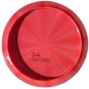 Diamond in Gold line plastic from Latitude 64. Colour is Red/pink with a black stamp. Name/number inked on back.