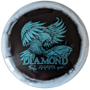 Gold Orbit Diamond with Inverted stamp from Latitude 64. Colour is Black with Teal stamp and white rim.